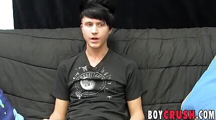 Young gay man jerks off his giant dick during an interview